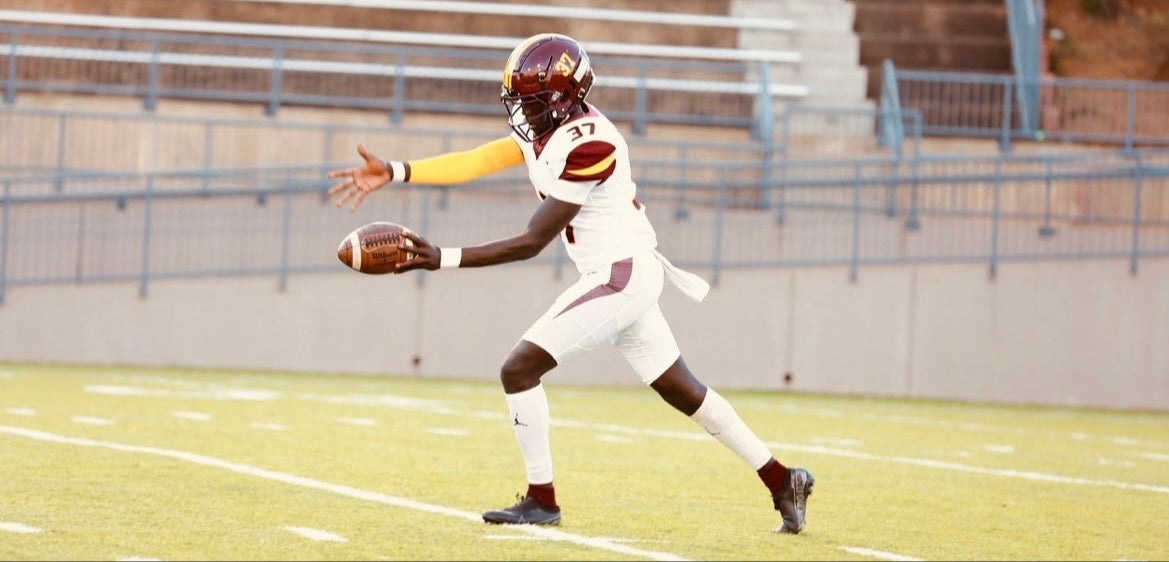 Hamady Diallo in football uniform preparing to kick a football on field